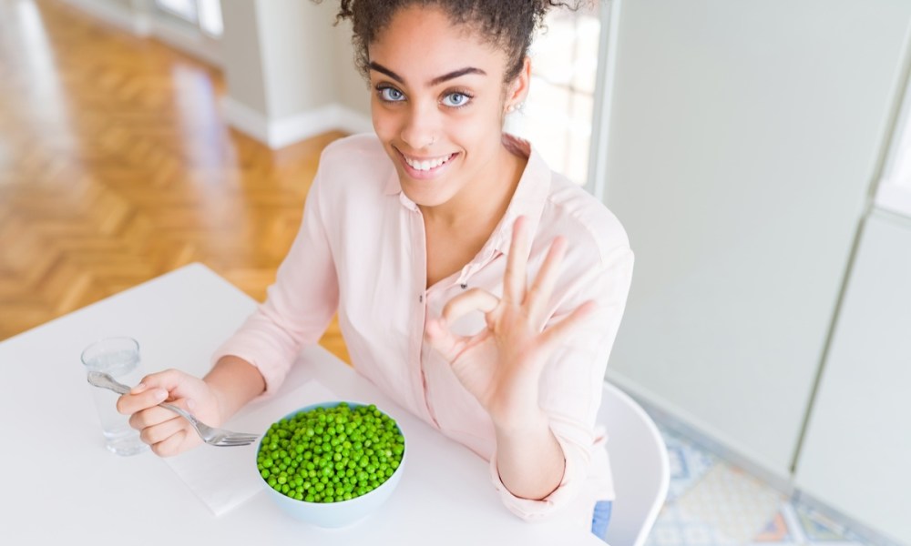 woman eating green