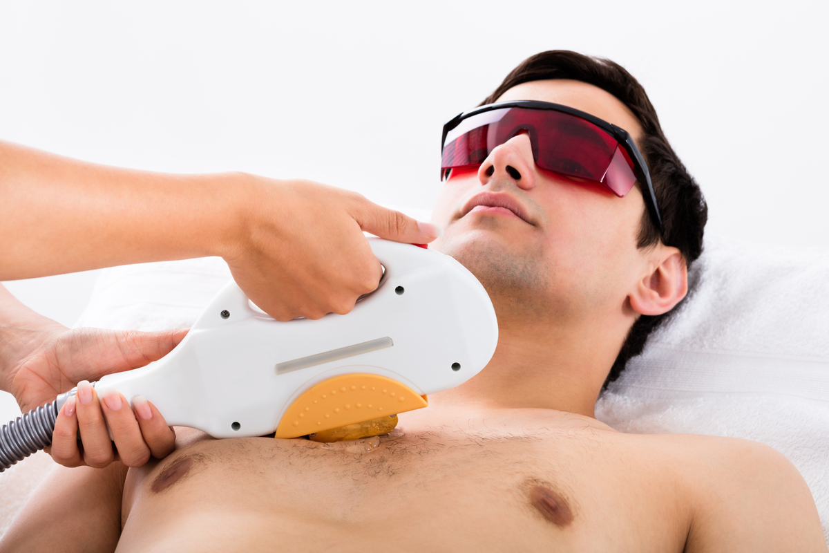 A man getting laser hair removal on his chest.